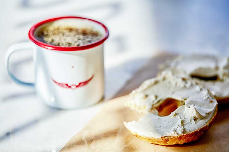 coffee and bagel with cream cheese. Great Bagel & Bakery in Lexington, KY